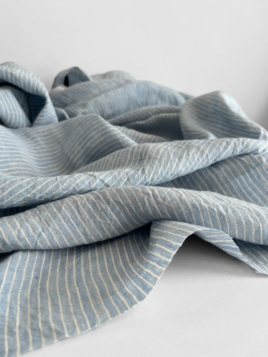 Blue striped fabric on a white background